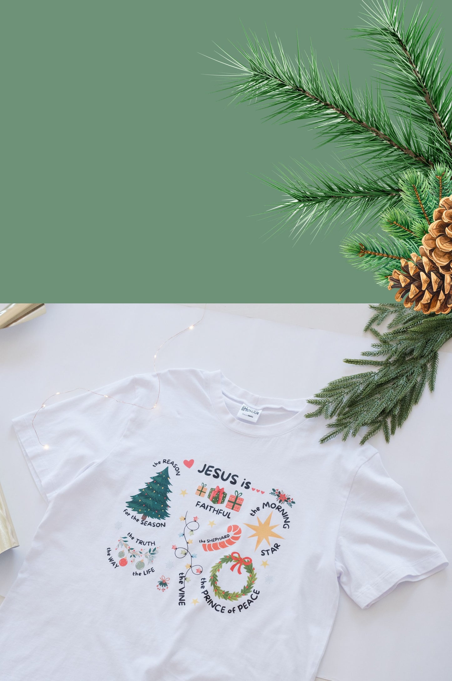 White Christmas graphic t-shirt with Jesus design, 100% cotton Christian tee flat lay with festive decor South Africa