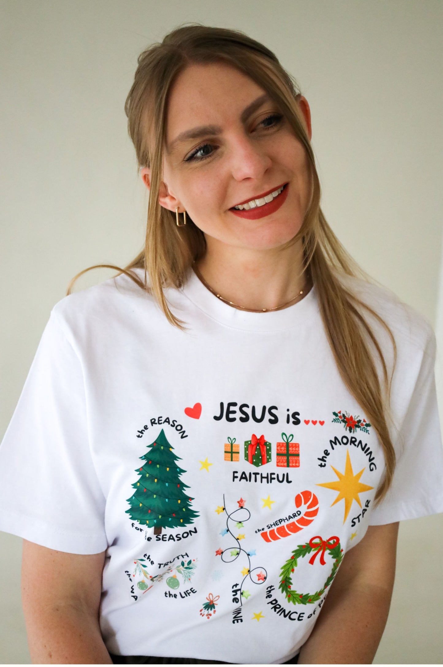 Woman wearing white Christmas t-shirt with Jesus graphic design, 100% cotton Christian tee South Africa