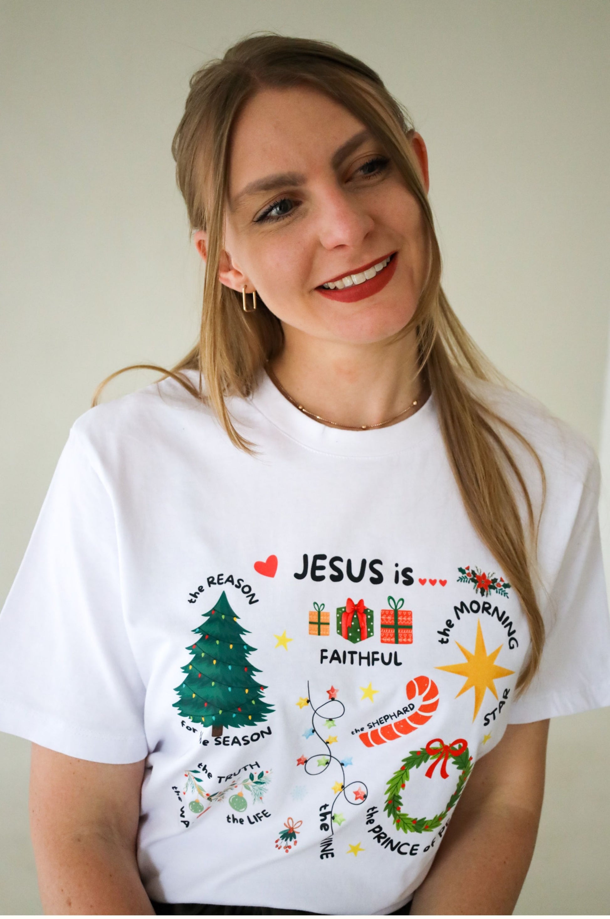 Woman wearing white Christmas t-shirt with Jesus graphic design, 100% cotton Christian tee South Africa