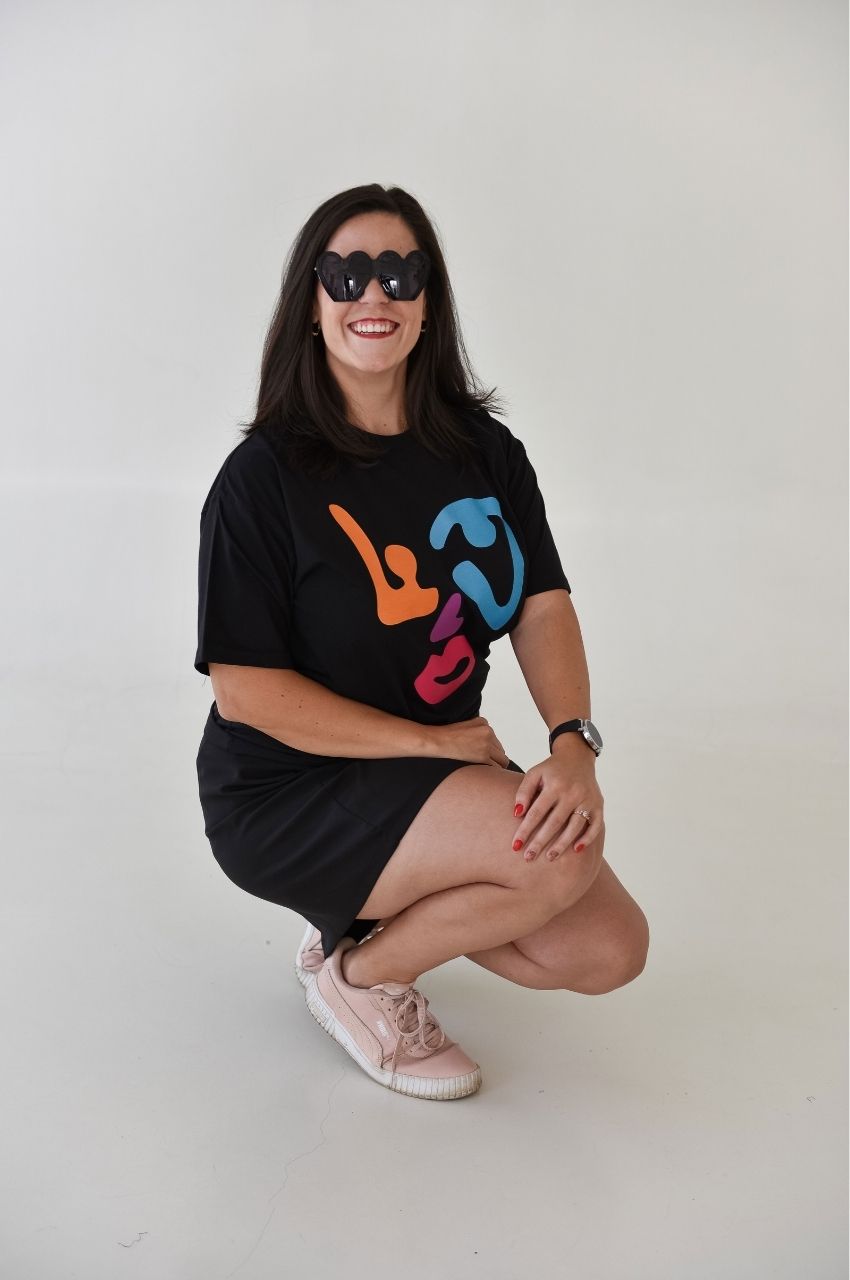 Woman styling black abstract face graphic t-shirt with casual outfit trendy look South Africa