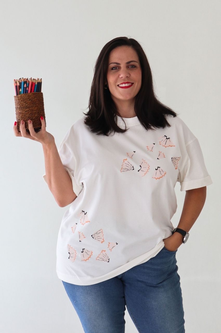 Woman wearing white t-shirt with pencil shaving design creative art shirt South Africa