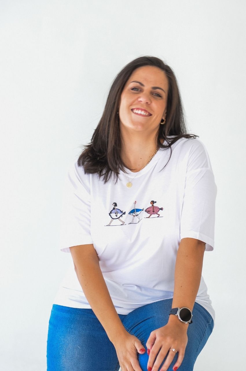 Woman wearing white t-shirt with quirky fish illustration casual fashion South Africa