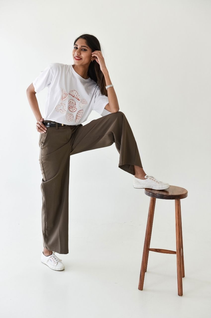 White t-shirt with food sketch design styled with trousers relaxed casual outfit South Africa