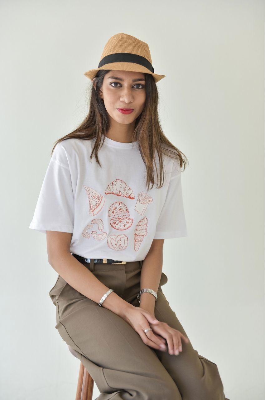 Woman wearing white t-shirt with minimal food illustration graphic casual fashion South Africa