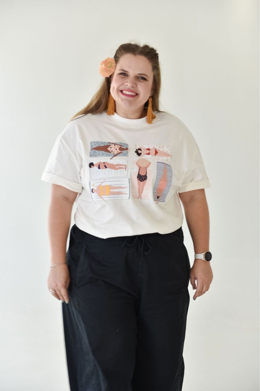 Woman wearing inclusive body illustration t-shirt celebrating diversity and summer lifestyle South Africa