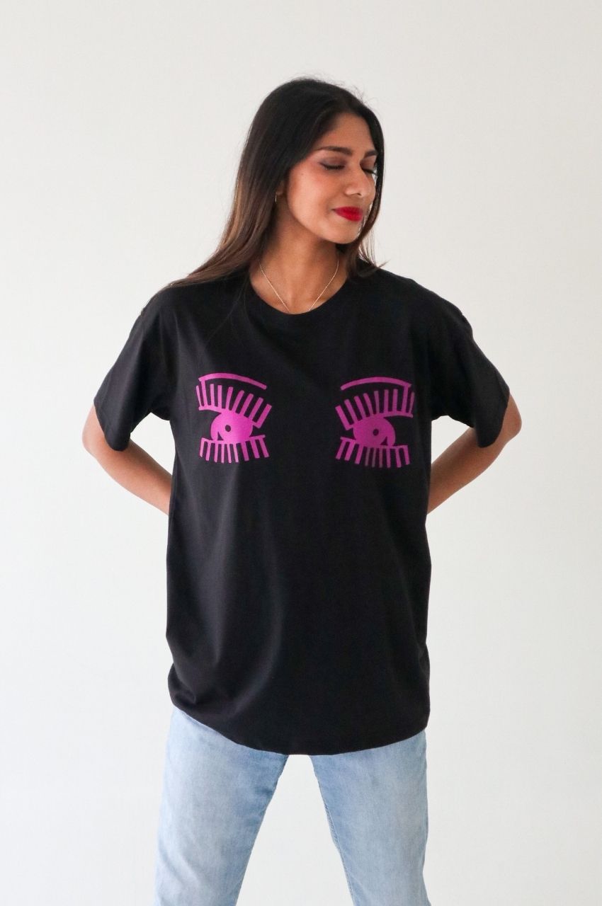 Woman wearing black t-shirt with pink eye graphic bold fashion statement South Africa