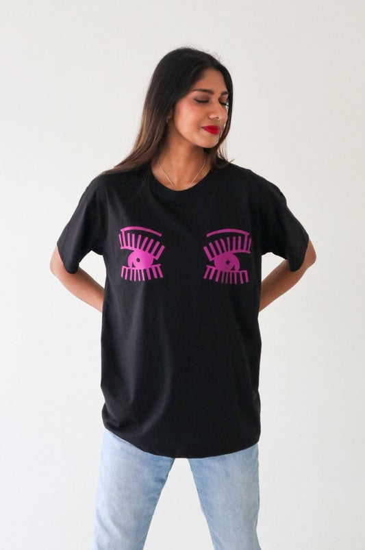 Woman wearing black t-shirt with pink eye graphic bold fashion statement South Africa