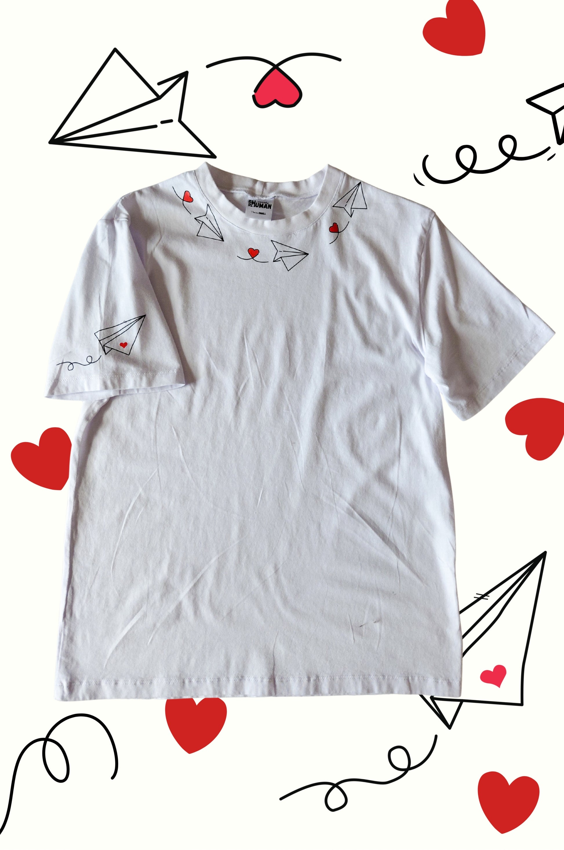 White graphic t-shirt with paper plane heart design, quirky 100% cotton tee product display South Africa